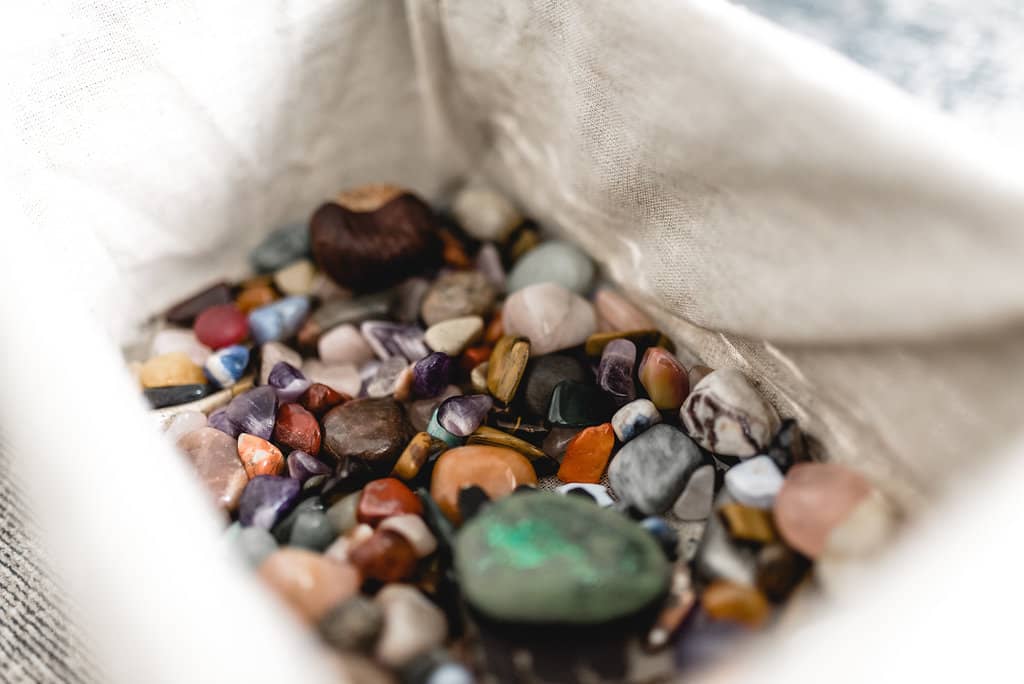 Small coloured stones can be used to represent resources in therapy and coaching